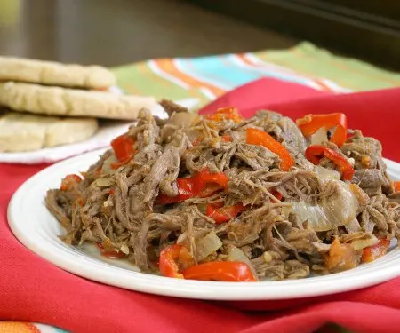 Slow cooked, shredded beef takes on incredible flavor in this Venezuelan Carne Mechada. | www.CuriousCuisiniere.com