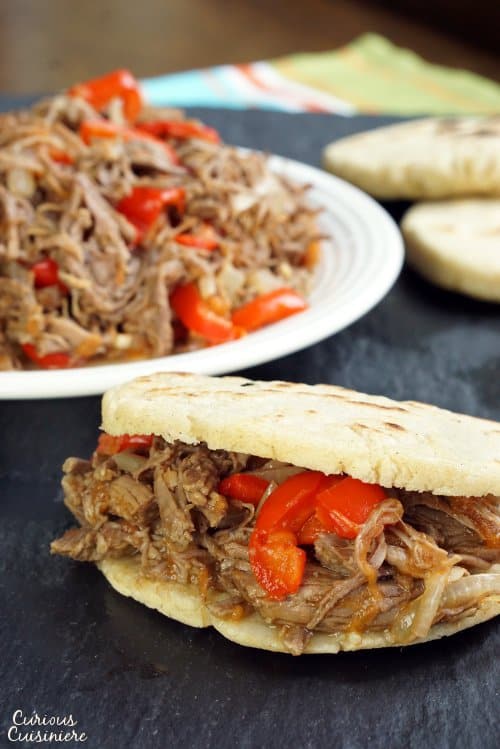 Slow cooked, shredded beef takes on incredible flavor in this Venezuelan Carne Mechada. | www.CuriousCuisiniere.com