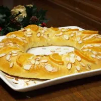 Rosca de Reyes is a soft, lightly sweet, orange scented bread that is traditionally eaten with a cup of hot chocolate on the Feast of the Epiphany. | www.CuriousCuisiniere.com
