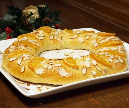 Rosca de Reyes is a soft, lightly sweet, orange scented bread that is traditionally eaten with a cup of hot chocolate on the Feast of the Epiphany. | www.CuriousCuisiniere.com