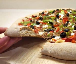 There's no need wait for pizza night with this quick and easy pizza dough that is ready in less than an hour. | www.CuriousCuisiniere.com
