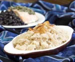 Savory and sweet Arroz con Coco is a wonderfully flavorful Colombian Coconut Rice side dish that you will soon find yourself addicted to! | www.CuriousCuisiniere.com