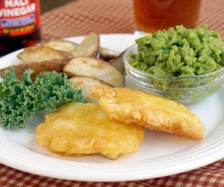 Crispy battered fish, served with a side of chips and mushy peas. Do you call it “fish and chips” or “fish fry”? Either way, British fish and chips is a recipe for some serious comfort food! | www.CuriousCuisiniere.com