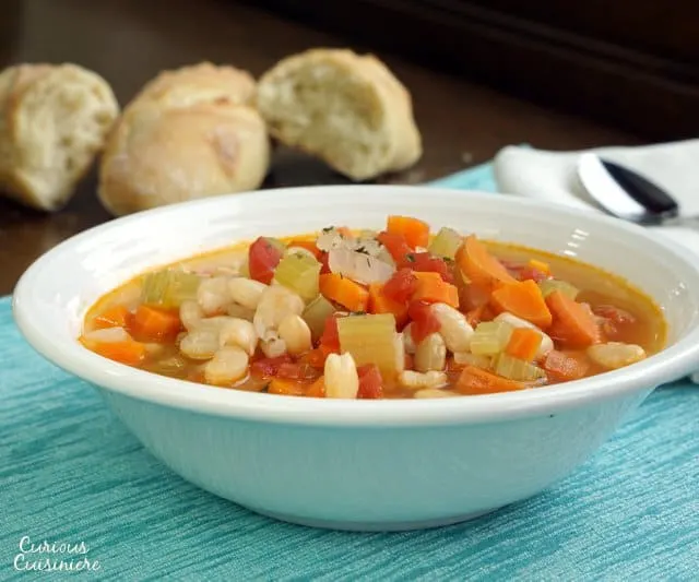 Fasolada is a hearty, healthy, and easy Greek Bean Soup that makes for the perfect vegetarian dinner. | www.CuriousCuisiniere.com