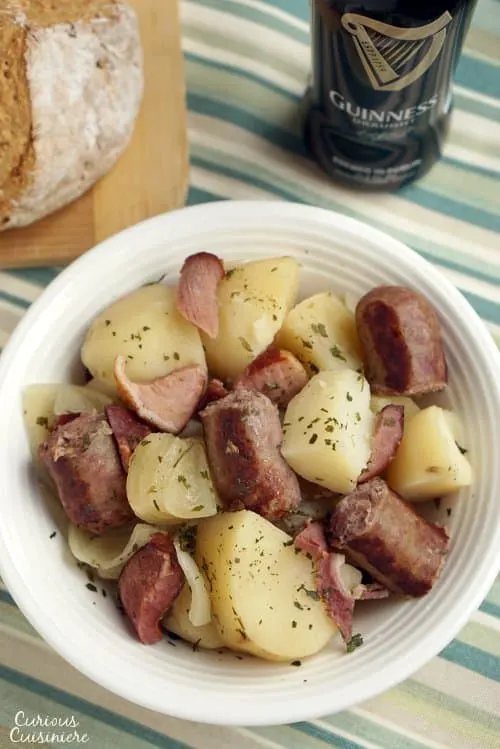 Slow cooker Dublin coddle recipe with sausage, bacon, sausage and potatoes. Serve this Irish stew with an Irish beer.