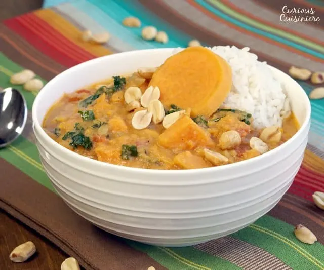 This Vegetarian African Peanut Soup with Sweet Potatoes is a perfect, comforting fall recipe, full of sweet and nutty flavors. | www.CuriousCuisiniere.com 