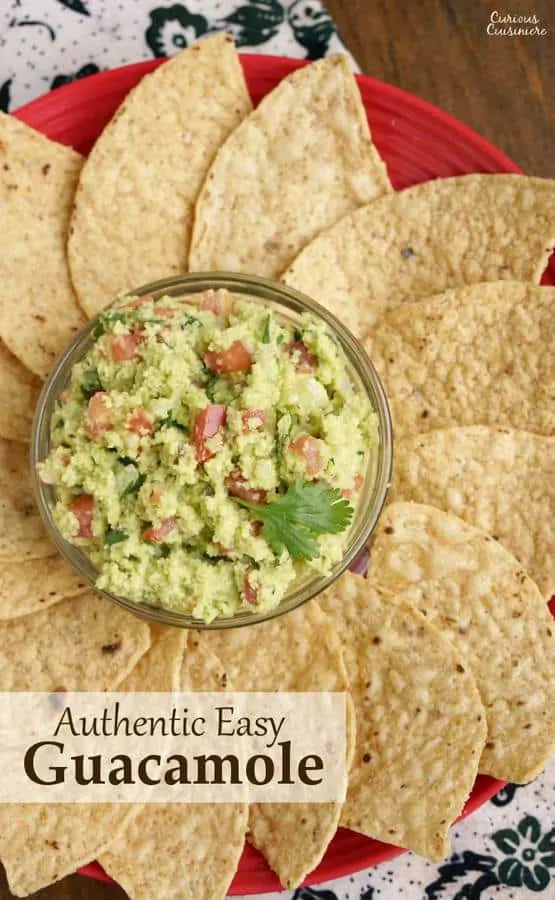 If you've never made guacamole from scratch, you'll be surprised how fun our Authentic Easy Guacamole recipe is. With just a few ingredients, you can be dipping away! | www.CuriousCuisiniere.com