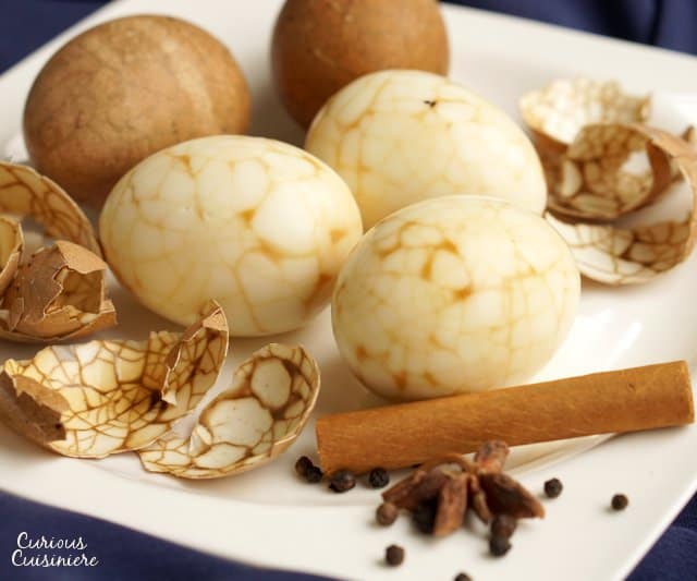 Take a new twist on dyed eggs this year with these Marbled Chinese Tea Eggs. The steeping liquid gives the eggs a light sweet and salty flavor, making these no ordinary eggs! | www.CuriousCuisiniere.com
