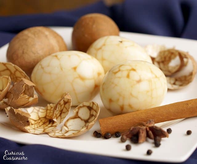 Take a new twist on dyed eggs this year with these Marbled Chinese Tea Eggs. The steeping liquid gives the eggs a light sweet and salty flavor, making these no ordinary eggs! | www.CuriousCuisiniere.com