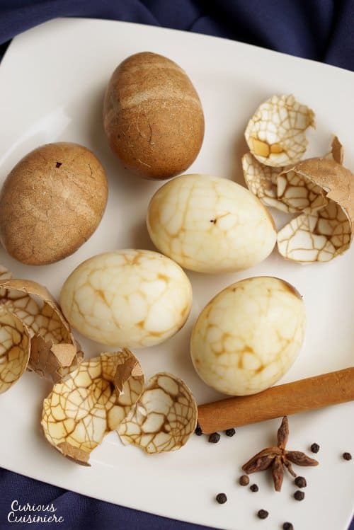 Take a new twist on dyed eggs this year with these Marbled Chinese Tea Eggs. The steeping liquid gives the eggs a light sweet and salty flavor, making these no ordinary eggs! | www.CuriousCuisiniere.com