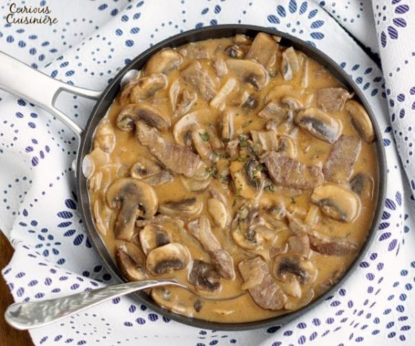 Beef Strogonoff is so much more than the 50s and 60s made it out to be. Our easy and authentic Russian Beef Stroganoff recipe combines tender beef and flavorful mushrooms in a creamy sauce for an elegant, yet quick dish. | www.CuriousCuisiniere.com