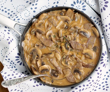 Beef Strogonoff is so much more than the 50s and 60s made it out to be. Our easy and authentic Russian Beef Stroganoff recipe combines tender beef and flavorful mushrooms in a creamy sauce for an elegant, yet quick dish. | www.CuriousCuisiniere.com