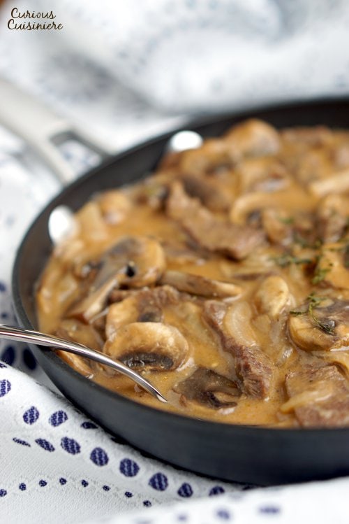 Beef Strogonoff is so much more than the 50s and 60s made it out to be. Our easy and authentic Russian Beef Stroganoff recipe combines tender beef and flavorful mushrooms in a creamy sauce for an elegant, yet quick dish. | www.CuriousCuisiniere.com