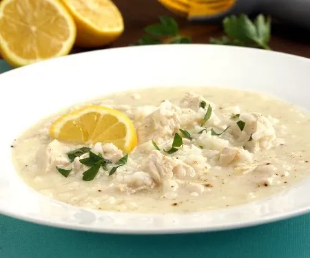 Avgolemono is a light, Greek soup that combines chicken, rice, and lemon in a perfectly refreshing meal or starter. | www.CuriousCuisiniere.com