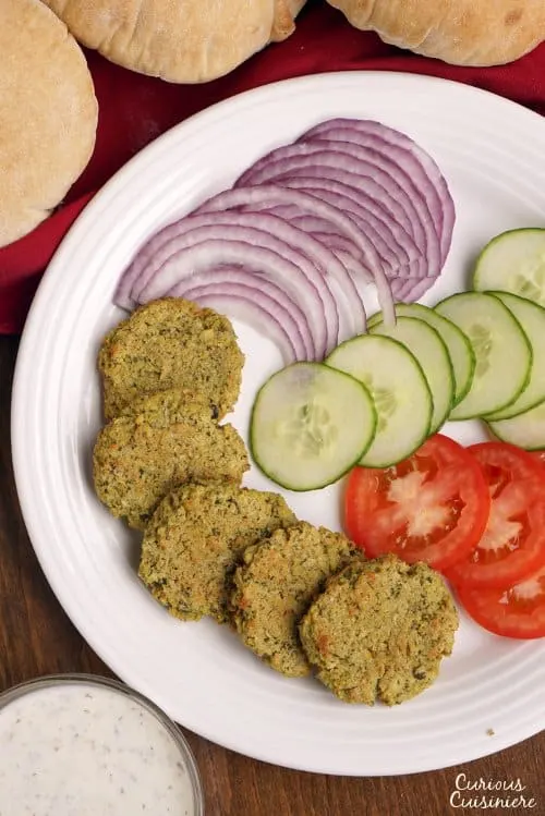 Baked Falafel gives you all the healthy, nutty falafel goodness without the hassle or added fat of frying, and it's just as good for stuffing into a pita! | www.CuriousCuisiniere.com