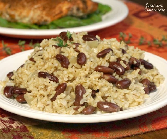 Jamaican Rice and Peas (or Caribbean Red Beans and Coconut Rice) is an easy and flavorful side dish that brings a fun tropical flair to your meal. | www.CuriousCuisiniere.com