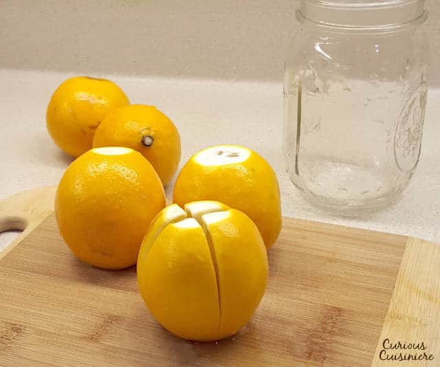 Moroccan Preserved lemons are easy to make and have many uses in traditional African and Middle Eastern cooking as well as unique modern twists. | www.CuriousCuisiniere.com