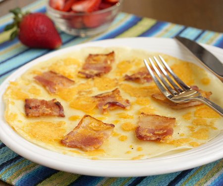 The Dutch pancake, Pannekoek, is a thin pancake that can be served sweet or savory. There are so many ways to enjoy this easy treat for breakfast or a fun snack! | www.CuriousCuisiniere.com