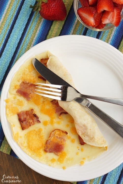 The Dutch pancake, Pannekoek, is a thin pancake that can be served sweet or savory. There are so many ways to enjoy this easy treat for breakfast or a fun snack! | www.CuriousCuisiniere.com