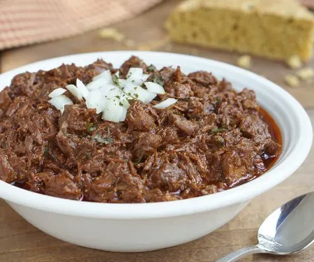 Thick and hearty Cowboy Chili, also known as Texas Red Chili, is sure to stick to your ribs and satisfy any meat lover. | www.CuriousCuisiniere.com
