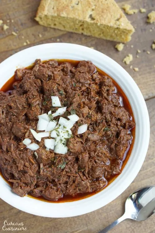 Thick and hearty Cowboy Chili, also known as Texas Red Chili, is sure to stick to your ribs and satisfy any meat lover. | www.CuriousCuisiniere.com