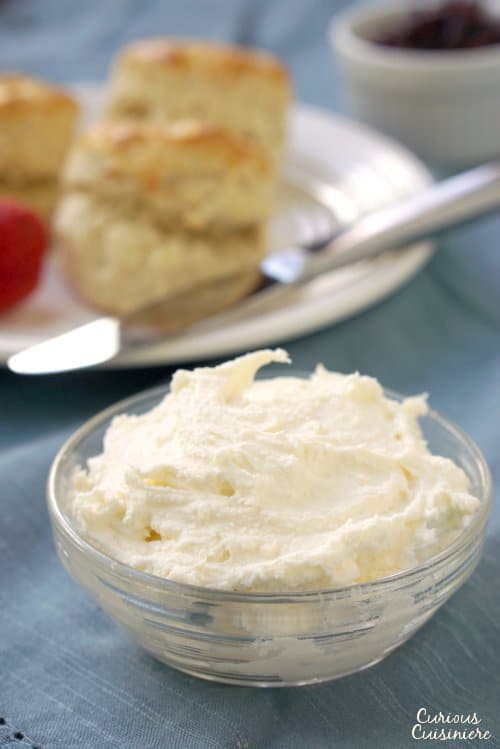 Clotted Cream is the essential companion to British scones, and it's so easy to make at home! | www.CuriousCuisiniere.com