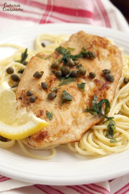 Lemon Chicken Piccata is an easy and flavorful dish that is the perfect recipe for a quick weeknight dinner. | www.CuriousCuisiniere.com 