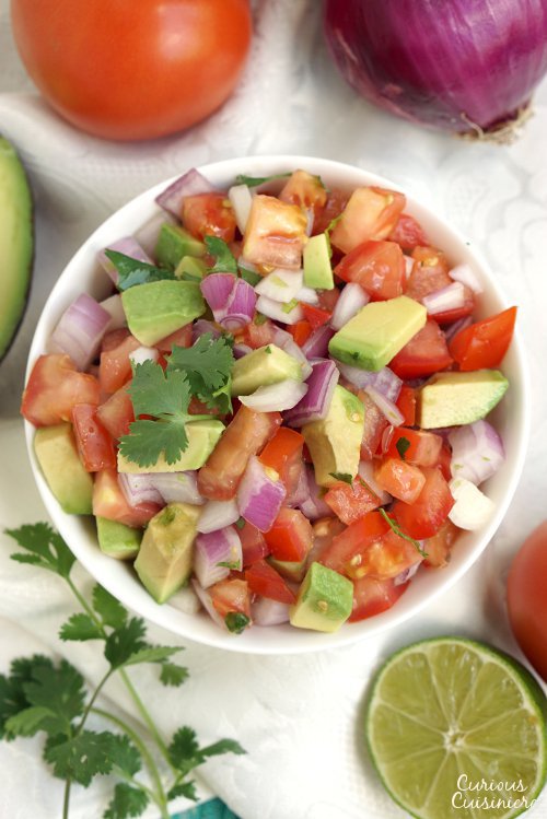 Kachumbari is a light and fresh tomato and onion salad that makes for a perfect summer side dish to pair with your grilled meats! | www.CuriousCuisiniere.com