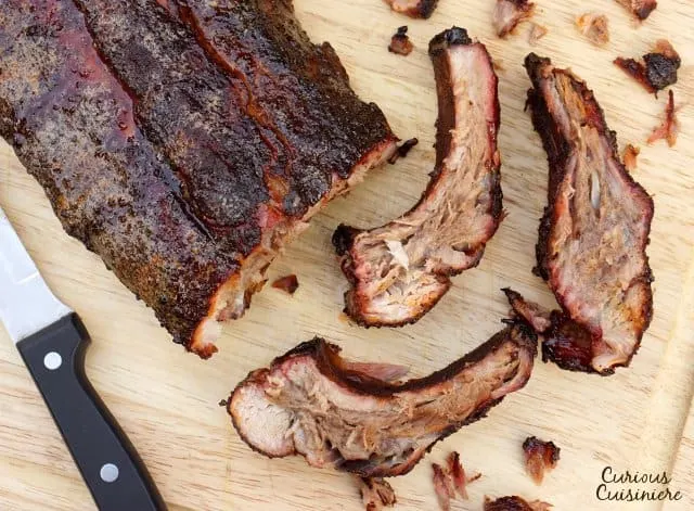 Cook up some Kansas City Style Ribs with this easy recipe for charcoal grill smoked baby back ribs! | www.CuriousCuisiniere.com 