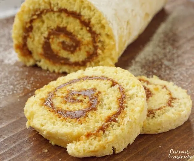 Chilean Brazo de Reina is a simple rolled Dulce de Leche Cake that brings a soft sponge cake together with creamy milk caramel filling for one addicting treat!  | www.CuriousCuisiniere.com