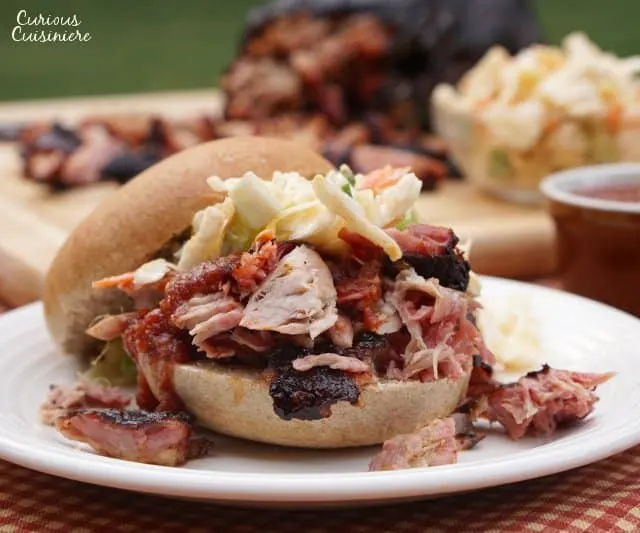 Juicy, flavorful, and perfectly balanced. That’s Memphis style BBQ. Our Memphis style barbecue pulled pork sandwich recipe brings smoked pork to perfection. | www.CuriousCuisiniere.com