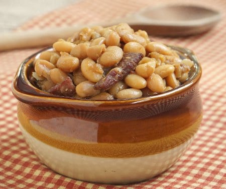 Your slow cooker does all the work for these deep and flavorful Boston Baked Beans. They're the perfect side dish for a party when you don't want to turn on the oven! | www.CuriousCuisiniere.com