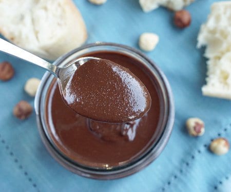 It may surprise you how easy it is to make Homemade Nutella. It's so quick and simple, we bet you'll be adding this Chocolate Hazelnut Spread to everything! | www.CuriousCuisiniere.com