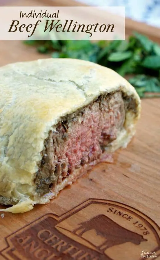 Individual Beef Wellington are an easy way to bring an over the top, classy feel to any special dinner. Our recipe pairs perfectly with a glass of smooth Merlot wine. | www.CuriousCuisiniere.com