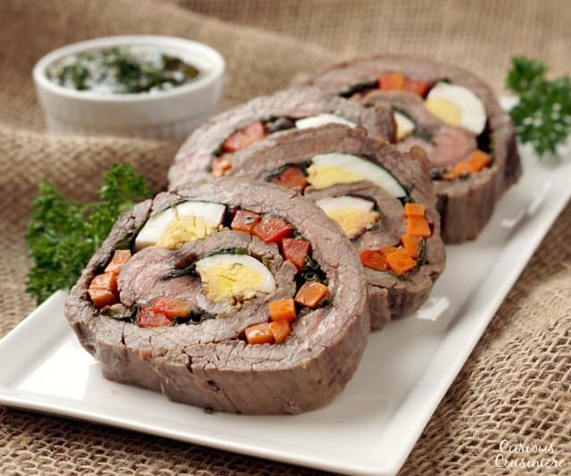 Matambre Arrollado is a flavorful Argentinian Stuffed Flank Steak that makes a unique and beautiful main dish or appetizer. | www.CuriousCuisiniere.com