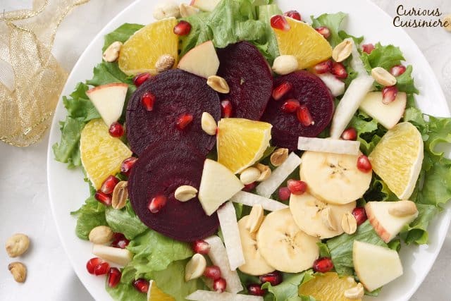 Ensalada Nochebuena is a bright and colorful Mexican Christmas Eve Salad full of seasonal vegetables and fruits. It's the perfect light and festive addition to your Christmas table! | www.CuriousCuisiniere.com