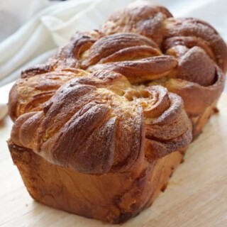 Tender and fluffy, and bursting with cinnamon flavor! Our Bread Machine Cinnamon Babka recipe makes this impressive, twisted sweet bread super easy to put together. | www.CuriousCuisiniere.com