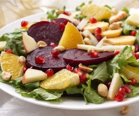 Ensalada Nochebuena is a bright and colorful Mexican Christmas Eve Salad full of seasonal vegetables and fruits. It's the perfect light and festive addition to your Christmas table!  | www.CuriousCuisiniere.com