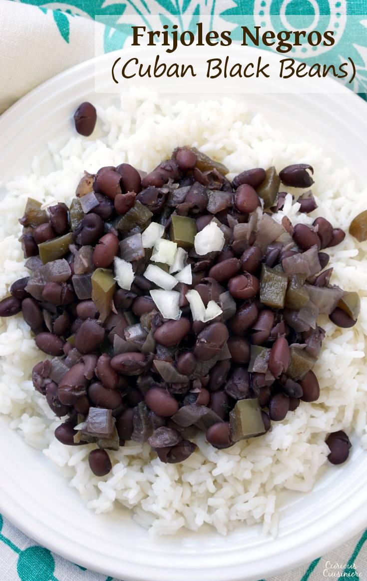 With lots of flavor from green peppers and onions, long simmering and deeply flavorful, black beans (frijoles negros) are the essential side dish to any Cuban meal. | www.CuriousCuisiniere.com