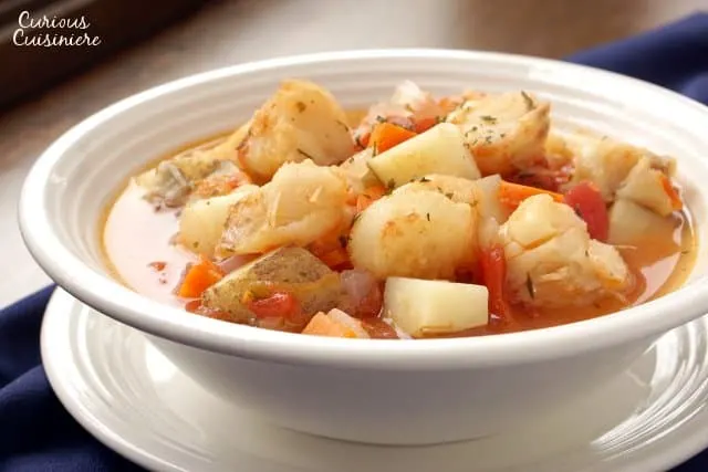 Manhattan Fish Chowder is the tomato broth-based fish stew that is New York's take on the traditional, creamy New England chowder. Where do you fall in the great chowder debate? | www.CuriousCuisiniere.com