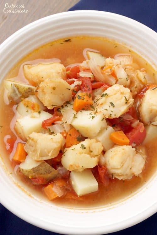 Manhattan Fish Chowder is the tomato broth-based fish stew that is New York's take on the traditional, creamy New England chowder. Where do you fall in the great chowder debate? | www.CuriousCuisiniere.com 