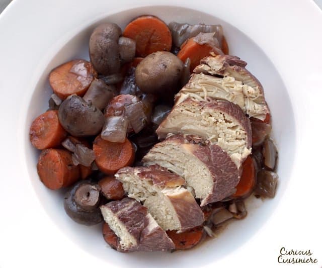 Our Slow Cooker Coq Au Vin recipe makes this classic French dish of wine braised chicken perfect for an easy weeknight dinner.  | www.CuriousCuisiniere.com