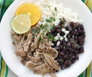 Tender and juicy Cuban Mojo Pork brings robust flavor of garlic and bright citrus notes to this easy, slow cooker recipe. | www.CuriousCuisiniere.com