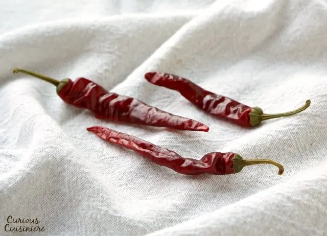 Cayenne chile peppers are bright red and often used dried and powdered.| www.CuriousCuisiniere.com