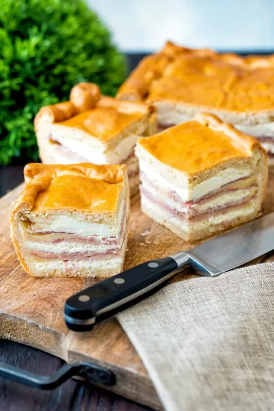 Pizza Gain Italian Easter Pizza cut on a cutting board