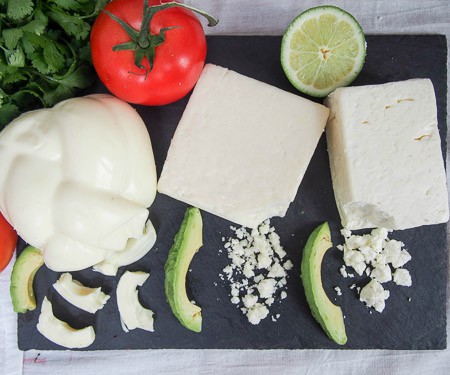 Horizontal spread of Mexican cheese with cotija, queso fresco, and oaxaca.
