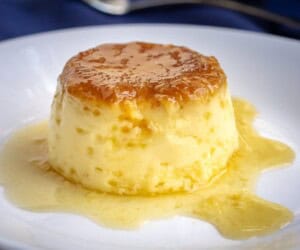 Spanish Flan is an egg custard dessert to make, impressive to serve to guests, and it can be made ahead of time. Spanish egg flan is creamy, caramely, and delicious! | www.CuriousCuisiniere.com