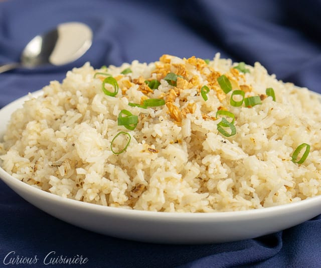 If you've never had Filipino Garlic Fried Rice, then you are missing out. Garlic elevates this simple fried rice recipe, giving it a robust flavor that make it a great side dish, no matter what meal you eat it for! | www.CuriousCuisiniere.com