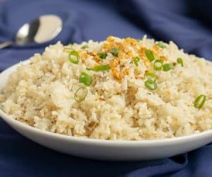 If you've never had Filipino Garlic Fried Rice, then you are missing out. Garlic elevates this simple fried rice recipe, giving it a robust flavor that make it a great side dish, no matter what meal you eat it for! | www.CuriousCuisiniere.com