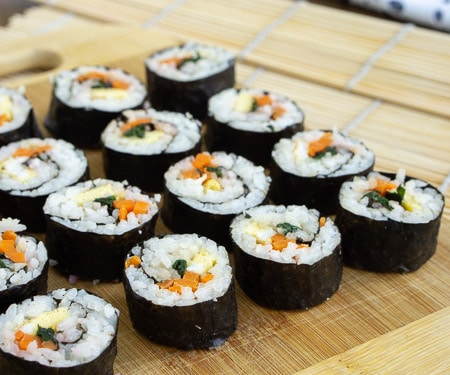 Kimbap (or gimbap) could be called Korean sushi, and if you are a fan of sushi, you are going to love the light and slightly nutty flavor of these rolls. They're the perfect recipe for summer picnics and lunches!  | www.CuriousCuisiniere.com